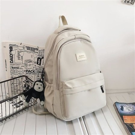 Ryggsekk for kvinner, ensfarget, multi-lomme, avslappet, reiseveske for kvinner, skolesekk for tenåringsjenter, bokryggsekk, beige, hvit med anheng