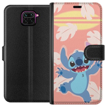Yhteensopiva Lompakkokotelo Xiaomi Redmi Note 9 Iloinen Stitchin kuva, joka hyppää vaaleanpunaisen taustan edessä surffilaudalla