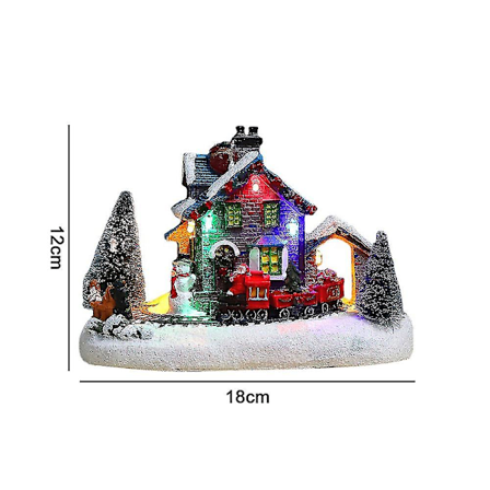 Julbyhus med Santa Claus, Snögubbe, Tåg och Snöscen - LED-belyst Juldekoration i Resin