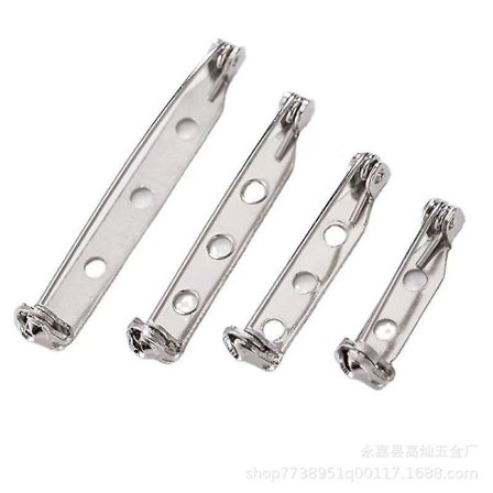 Låda med säkerhetsnålar och spännen i olika storlekar, platinfärgade broschnålar