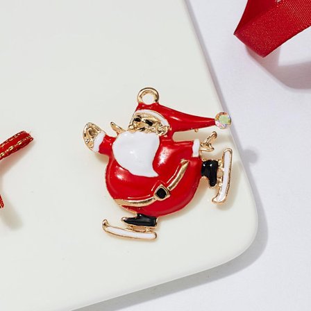 Broche med julemanden der skøjter guld diamant