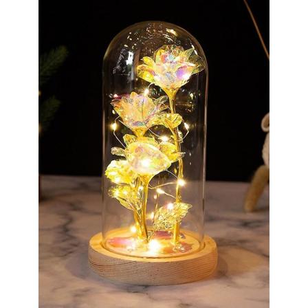 LED-belyst förtrollad roslampa i guldfolie