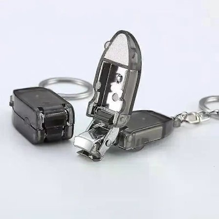 Hot Bedste Nye Sælger Mini Bærbar Negleklipper Plastikhåndtag Roterende Negleklipper med Nøglering fra Kina Fabrik