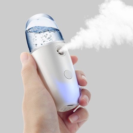 Sähköiset pienet suihkepullot, kädessä pidettävät uudelleentäytettävät matkamini tyhjät jatkuvat suihkepullot