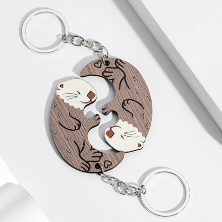 2 stk. søte oterpar-nøkkelringer - Trematchende puslespillnøkkelringer