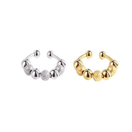 Justerbara antistressringar med roterbara pärlor Silver/Guld 2-pack