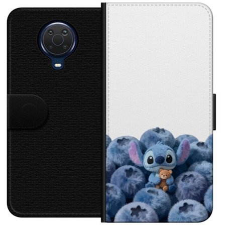 Kompatibel Tegnebogsetui til Nokia Nokia G20 Sød blå karakter blandt blåbær med bamse i blød og legende illustration