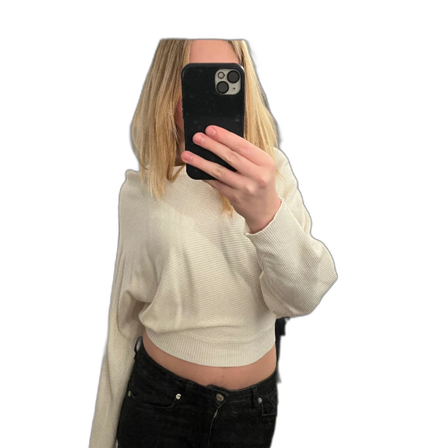 Stickad tröja med rosett