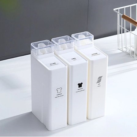 Hvit vaskemiddelbeholder for vaskemiddel