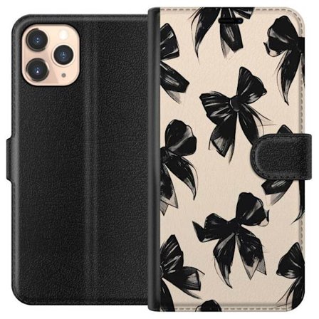 Apple iPhone 11 Pro Lompakkokotelo Mustat nauhat beige taustalla tyylikkäällä suunnittelulla, pehmeillä kontrasteilla ja elegantilla ajattomalla t