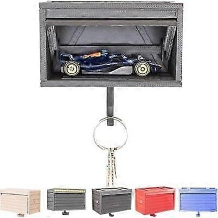 Nyckelhållare i form av bilgarage med öppningsbar dörr, nyckelhållare för vägg