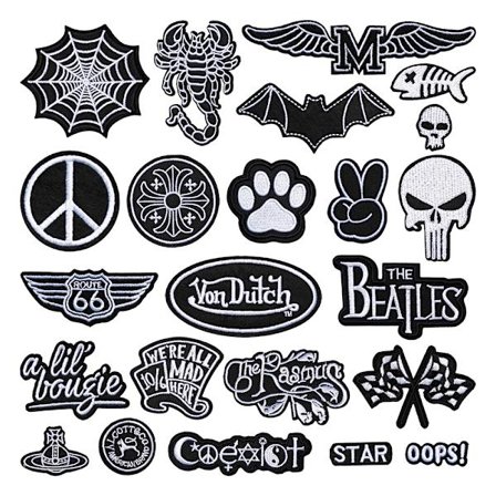 Mustavalkoinen ikonisarja: erilaisia skorpioni-, lepakonsiipi- ja pääkalloaiheisia brodeerattuja merkkejä/tarroja.