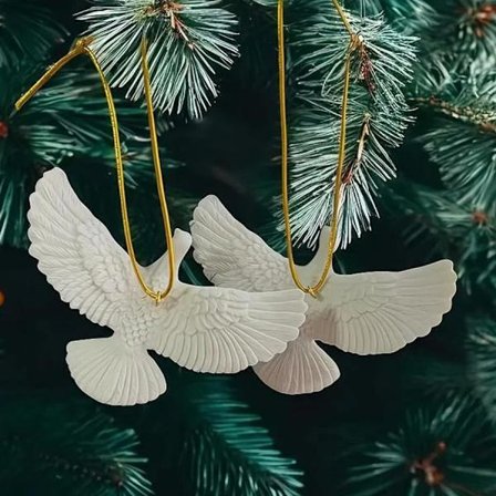 Designet i form av en due, som symboliserer vennskap. 2 interiørartikler