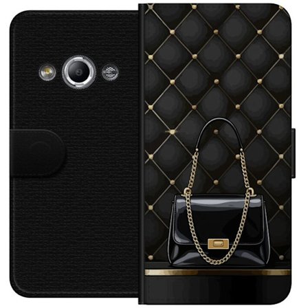 Yhteensopiva Lompakkokotelo Samsung Galaxy Xcover 3 Musta lakerilaukku kultaisella ketjulla vasten tikattua taustaa