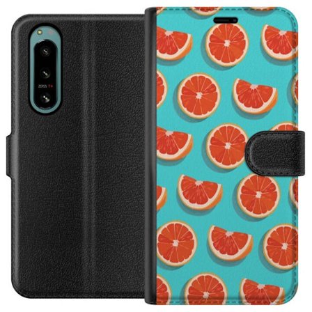 Kompatibelt Lommeboketui til Sony Xperia 5 IV Illustrert mønster med gjentatte grapefrukt skiver mot en turkis bakgrunn