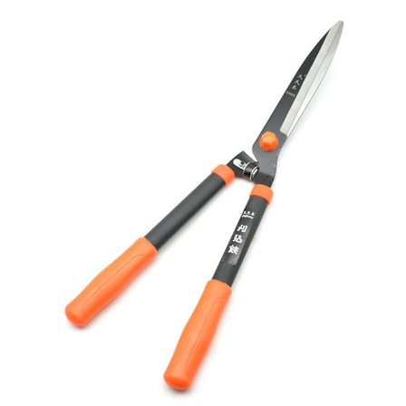 Orange röd-häcksax och trädgårdsgrenklippare. Trädgårdssax med dubbelt skärsystem i ett trädgårdsverktyg