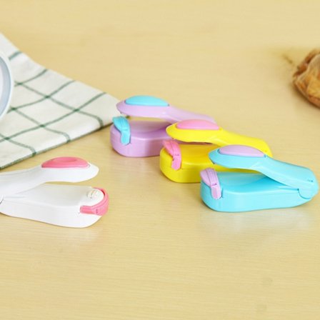 4 kpl kannettavaa kotikäyttöön tarkoitettua muovipussien sulkemislaitetta, käsimatka