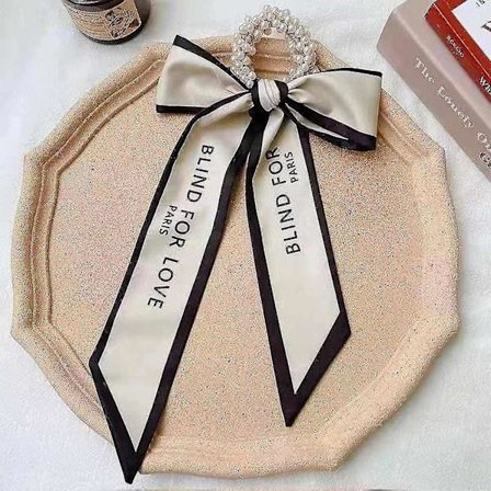 Pärlband med rosett för hår, vit och svart, långt band