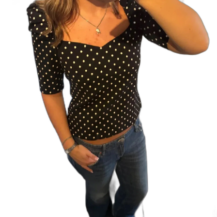 Svart prickig topp