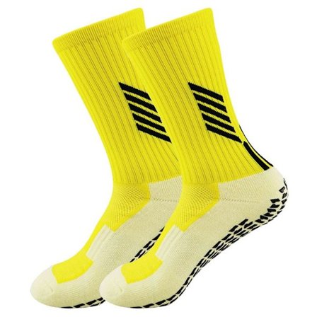 Liukumattomat jalkapallosukat. Urheilukalvosimet, joissa liukumatonta pitoa antava pehmuste keltaisessa KLB:ssä