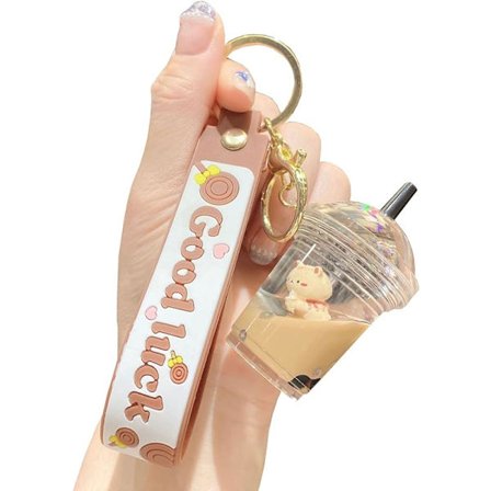 Söt nyckelring med pärlmjölkskopp, flytande björn i flytande kvicksand