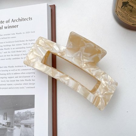 Stor ättiksyra hårklämma som griper tag i hårplattan, hårklämma